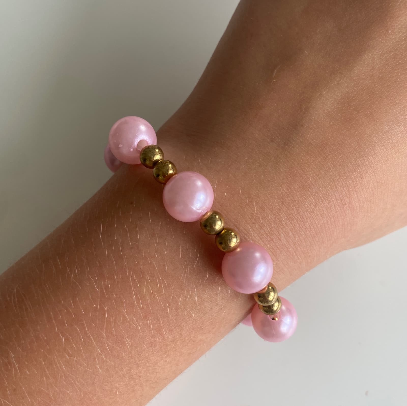 Rosa/guld armband